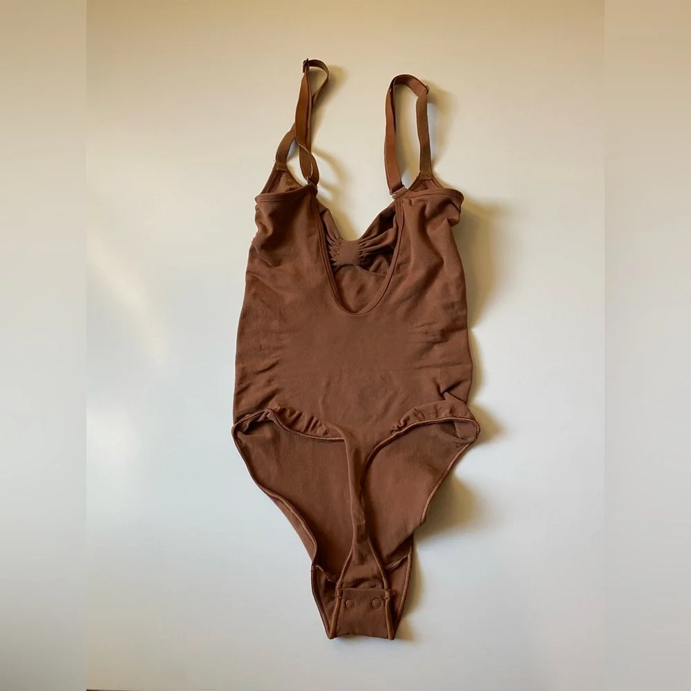 Skims Seamless Sculpting Thong Bodysuit in Bronze